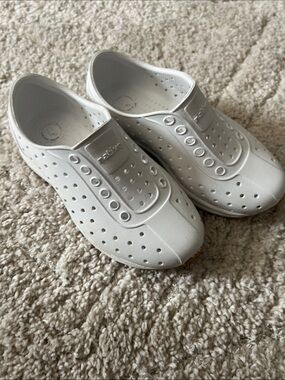 Native White Slip-On Perforated Shoes by Native